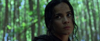 Movie still from “Predators” (2010), directed by Nimród Antal – A person with wet hair; Close Up shot, Low angle