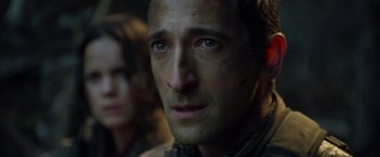 Movie still from “Predators” (2010), directed by Nimród Antal – A person looking at the camera; Close Up shot, Over the shoulder angle