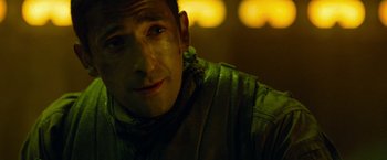 Movie still from “Predators” (2010), directed by Nimród Antal – A person wearing a jacket; Close Up shot, Over the shoulder angle