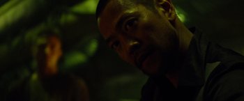 Movie still from “Predators” (2010), directed by Nimród Antal – A person looking at the camera; Close Up shot, Over the shoulder angle