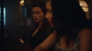 Movie still from “Euphoria” (2019), created by Sam Levinson – A woman sitting at a table with another woman in the background; Close Up shot, Over the shoulder angle