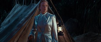 Movie still from “Australia” (2008), directed by Baz Luhrmann – A woman standing in front of a teepee holding a lantern; Medium shot, Low angle