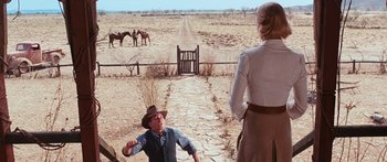 Movie still from “Australia” (2008), directed by Baz Luhrmann – A man and a woman standing on a dirt road; Wide shot, Over the shoulder angle