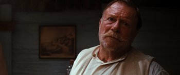Movie still from “Australia” (2008), directed by Baz Luhrmann – An older man with a beard and a mustache; Close Up shot, Low angle