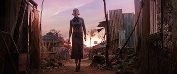 Movie still from “Australia” (2008), directed by Baz Luhrmann – A woman is walking through a dirt field; Wide shot, Low angle
