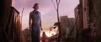 Movie still from “Australia” (2008), directed by Baz Luhrmann – A woman standing next to a child in a field; Medium shot, Low angle