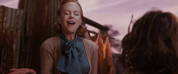 Movie still from “Australia” (2008), directed by Baz Luhrmann – A woman with her eyes closed and her mouth open; Medium shot, Low angle