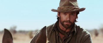 Movie still from “Australia” (2008), directed by Baz Luhrmann – A person wearing a cowboy hat; Close Up shot, Over the shoulder angle