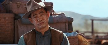 Movie still from “Australia” (2008), directed by Baz Luhrmann – An older man wearing a hat and a vest; Close Up shot, Over the shoulder angle