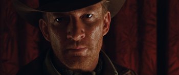 Movie still from “Australia” (2008), directed by Baz Luhrmann – A person wearing a hat and looking at the camera; Close Up shot, Low angle