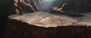 Movie still from “Australia” (2008), directed by Baz Luhrmann – A view of a canyon from above with horses in the distance; Extreme Wide shot, High angle