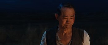 Movie still from “Australia” (2008), directed by Baz Luhrmann – An older man with his eyes closed and his head tilted to the side; Close Up shot, Over the shoulder angle