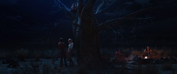 Movie still from “Australia” (2008), directed by Baz Luhrmann – A group of people standing next to a large tree; Extreme Wide shot, High angle