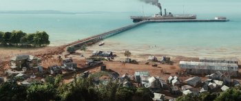 Movie still from “Australia” (2008), directed by Baz Luhrmann – An aerial view of a beach with a pier in the background; Extreme Wide shot, High angle
