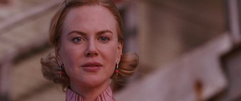 Movie still from “Australia” (2008), directed by Baz Luhrmann – A person wearing a pink shirt; Close Up shot, Over the shoulder angle