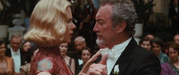 Movie still from “Australia” (2008), directed by Baz Luhrmann – A man and a woman in formal wear in front of a group of onlookers; Close Up shot, Over the shoulder angle