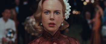 Movie still from “Australia” (2008), directed by Baz Luhrmann – A person with a flower in her hair; Close Up shot, Over the shoulder angle