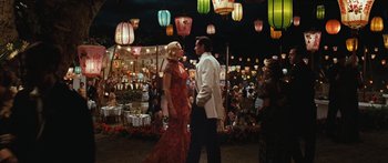 Movie still from “Australia” (2008), directed by Baz Luhrmann – A man and a woman are walking through a market; Wide shot, High angle