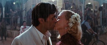 Movie still from “Australia” (2008), directed by Baz Luhrmann – A man and a woman kissing each other in the rain; Close Up shot, Low angle
