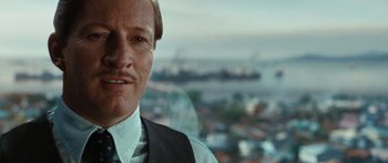 Movie still from “Australia” (2008), directed by Baz Luhrmann – A person wearing a suit and tie; Close Up shot, Over the shoulder angle