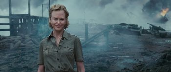 Movie still from “Australia” (2008), directed by Baz Luhrmann – A woman standing in front of an area that has smoke coming out of it; Medium shot, Over the shoulder angle
