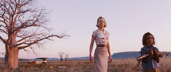 Movie still from “Australia” (2008), directed by Baz Luhrmann – A woman standing in the middle of an open field; Wide shot, Low angle
