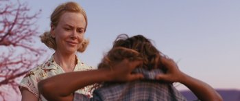 Movie still from “Australia” (2008), directed by Baz Luhrmann – A woman standing next to a man with his hands on his shoulders; Close Up shot, Over the shoulder angle