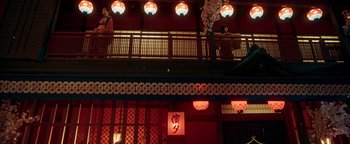 Movie still from “Prisoners of the Ghostland” (2021), directed by Sion Sono – A building that has a lot of lights hanging from the ceiling; Extreme Wide shot, Low angle