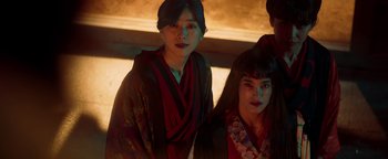 Movie still from “Prisoners of the Ghostland” (2021), directed by Sion Sono – Two young women dressed in traditional japanese garb; Medium shot, Low angle