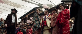 Movie still from “Prisoners of the Ghostland” (2021), directed by Sion Sono – A group of young women standing next to each other; Medium shot, Low angle