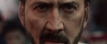 Movie still from “Prisoners of the Ghostland” (2021), directed by Sion Sono – A man's face with a beard; Extreme Close Up shot, Low angle
