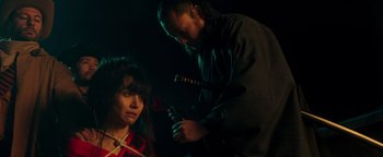 Movie still from “Prisoners of the Ghostland” (2021), directed by Sion Sono – A man and a woman are looking at each other; Close Up shot, Over the shoulder angle