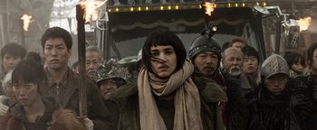 Movie still from “Prisoners of the Ghostland” (2021), directed by Sion Sono – A group of people standing next to each other; Close Up shot, Low angle