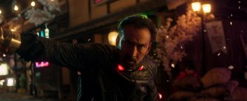 Movie still from “Prisoners of the Ghostland” (2021), directed by Sion Sono – A person wearing a leather jacket; Close Up shot, Low angle