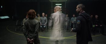 Movie still from “Prometheus” (2012), directed by Ridley Scott – A group of people sitting in a circle; Medium shot, Over the shoulder angle