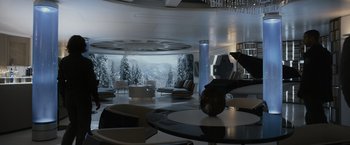 Movie still from “Prometheus” (2012), directed by Ridley Scott – A living room filled with furniture next to a large window; Wide shot, High angle