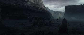 Movie still from “Prometheus” (2012), directed by Ridley Scott – A group of people standing in front of a rock formation; Extreme Wide shot, High angle