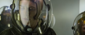 Movie still from “Prometheus” (2012), directed by Ridley Scott – A man wearing a space suit and a helmet; Close Up shot, Over the shoulder angle