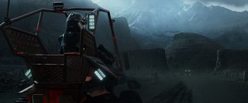 Movie still from “Prometheus” (2012), directed by Ridley Scott – A man riding a vehicle on top of a mountain; Extreme Wide shot, High angle