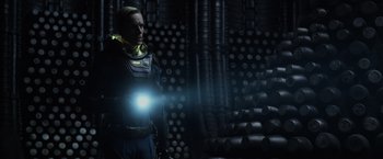 Movie still from “Prometheus” (2012), directed by Ridley Scott – A man with a light in his hand; Medium shot, Low angle