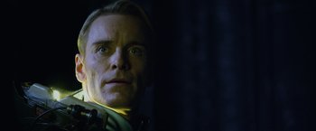 Movie still from “Prometheus” (2012), directed by Ridley Scott – A person wearing a green shirt; Close Up shot, Low angle