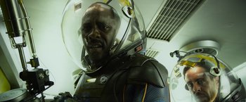 Movie still from “Prometheus” (2012), directed by Ridley Scott – A man wearing a space suit and a helmet; Close Up shot, Low angle