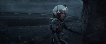 Movie still from “Prometheus” (2012), directed by Ridley Scott – A woman wearing a space suit and a helmet; Medium shot, Over the shoulder angle