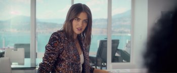 Movie still from “Puppy Love” (2023), directed by Richard Alan Reid – A beautiful young lady wearing a brown and black jacket; Medium shot, Over the shoulder angle