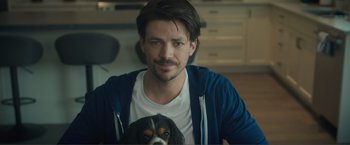 Movie still from “Puppy Love” (2023), directed by Richard Alan Reid – A person with a dog; Close Up shot, Over the shoulder angle