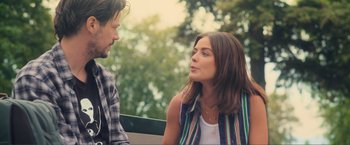 Movie still from “Puppy Love” (2023), directed by Richard Alan Reid – A man and a woman are talking to each other outside; Medium shot, Over the shoulder angle