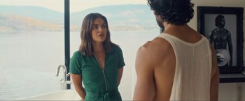 Movie still from “Puppy Love” (2023), directed by Richard Alan Reid – A woman and a man standing next to a body of water; Medium shot, Over the shoulder angle