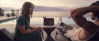 Movie still from “Puppy Love” (2023), directed by Richard Alan Reid – A man and a woman sitting next to each other; Wide shot, High angle