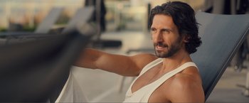 Movie still from “Puppy Love” (2023), directed by Richard Alan Reid – A person wearing a tank top; Close Up shot, Over the shoulder angle