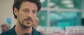 Movie still from “Puppy Love” (2023), directed by Richard Alan Reid – A person wearing a blue shirt; Close Up shot, Over the shoulder angle